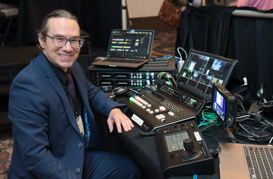 man posing with video systems technology